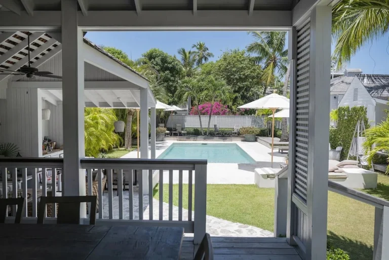 Pool seen from the covered porch at Java Cottage, Dunmore Town, Harbour Island