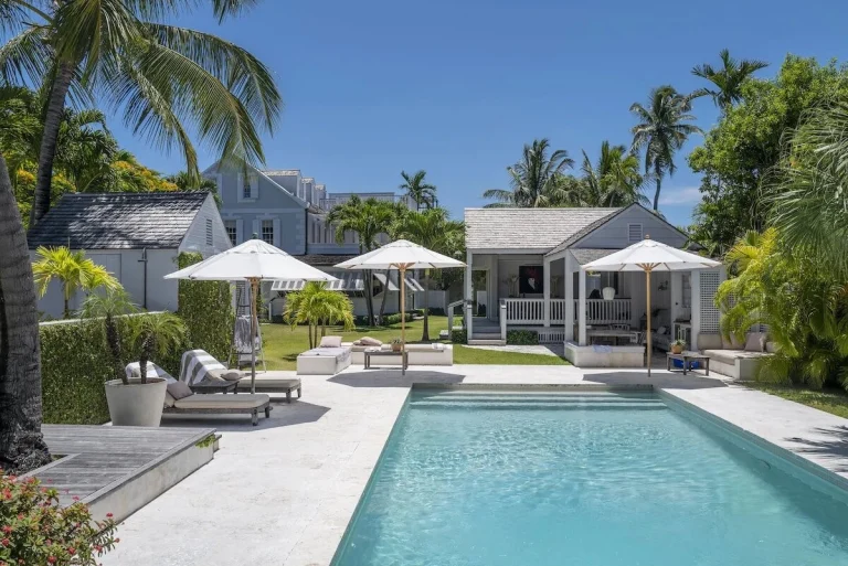 Pool with loungers and cottages at Java Cottage, Dunmore Town, Harbour Island