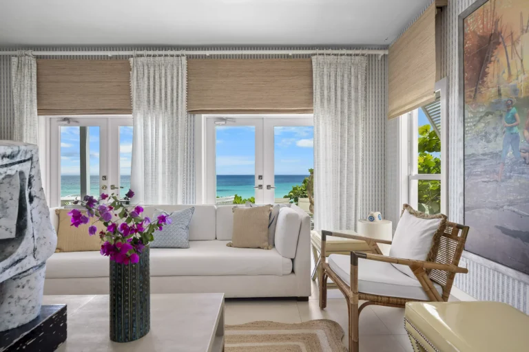 Living room with white sofas and ocean view at Sea Siren, Dunmore Town, Harbour Island