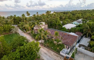Aerial view of the house among the trees at Surf Shack, Dunmore Town, Harbour Island
