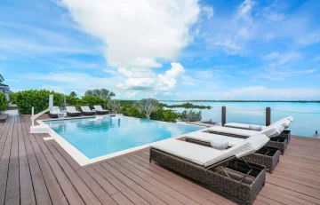 Pool deck with loungers at Villa Ana, Hartswell, Great Exuma